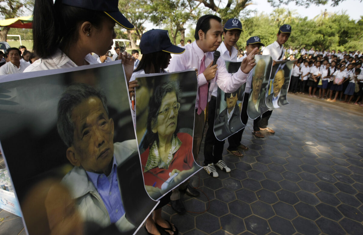 Court officer of the Khmer Rouge Tribunal speaks with students during a public forum in Phnom Penh