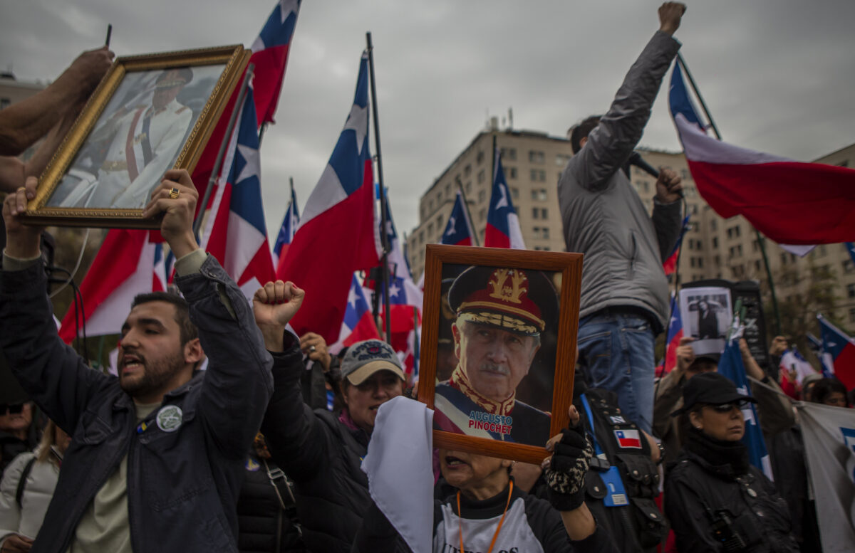 Far-right groups gather in front of La Moneda presidential palace on 9 September 2023 in Santiago de Chile to celebrate the 1973 coup d'etat